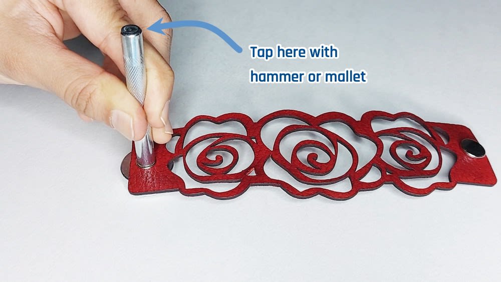 Tap with hammer Tap with hammer or mallet on the flat end of concave installation tool.