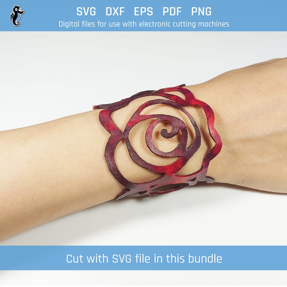 S05 demo 2 Example of a bracelet cut from this SVG design file. The bracelet is laid flat on a white surface with three roses assembled side by side on a bracelet that is cut using a Cricut cutting machine, closed with snap fasteners. Colour is red and purple.