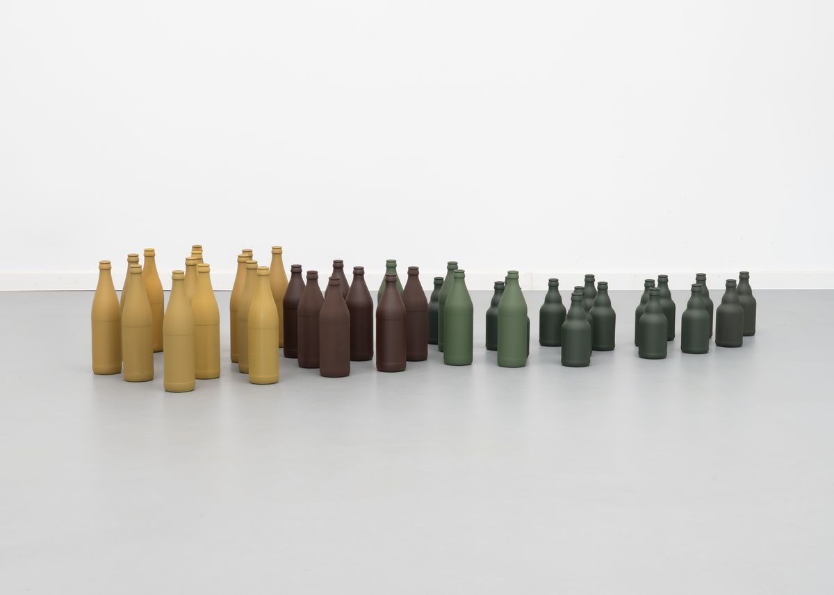 The pack (das Rudel), 2023. Paint on glass bottles, 170 × 75 × 26 cm (dimensions variable). From the series DIN – Standard parts in RAL colors. - Detail 1