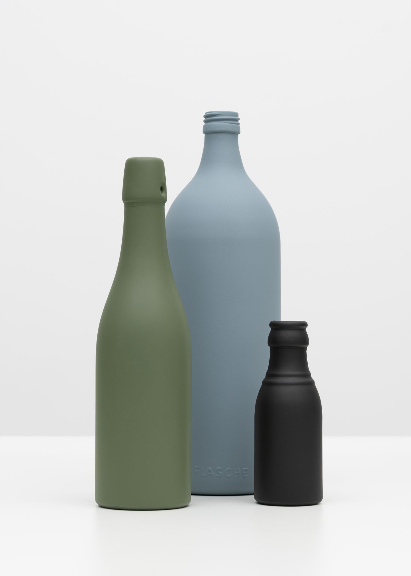 Bottles (Olive Green, Twilight Grey, Black Grey), 2026. Pigment print, 59 × 42 / 84 × 59 / 119 × 84 cm. From the series TGL – GDR Standards and Colors.