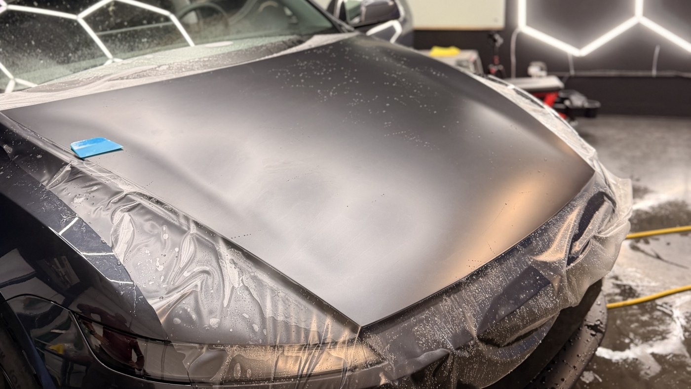 Vehicle paint inspected inside the CDA Auto Styling studio before protection planning