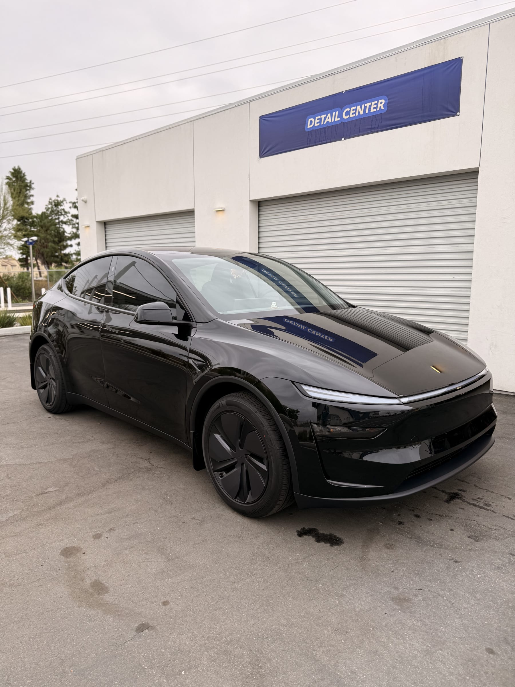 New black Tesla outside CDA Auto Styling ready for paint protection