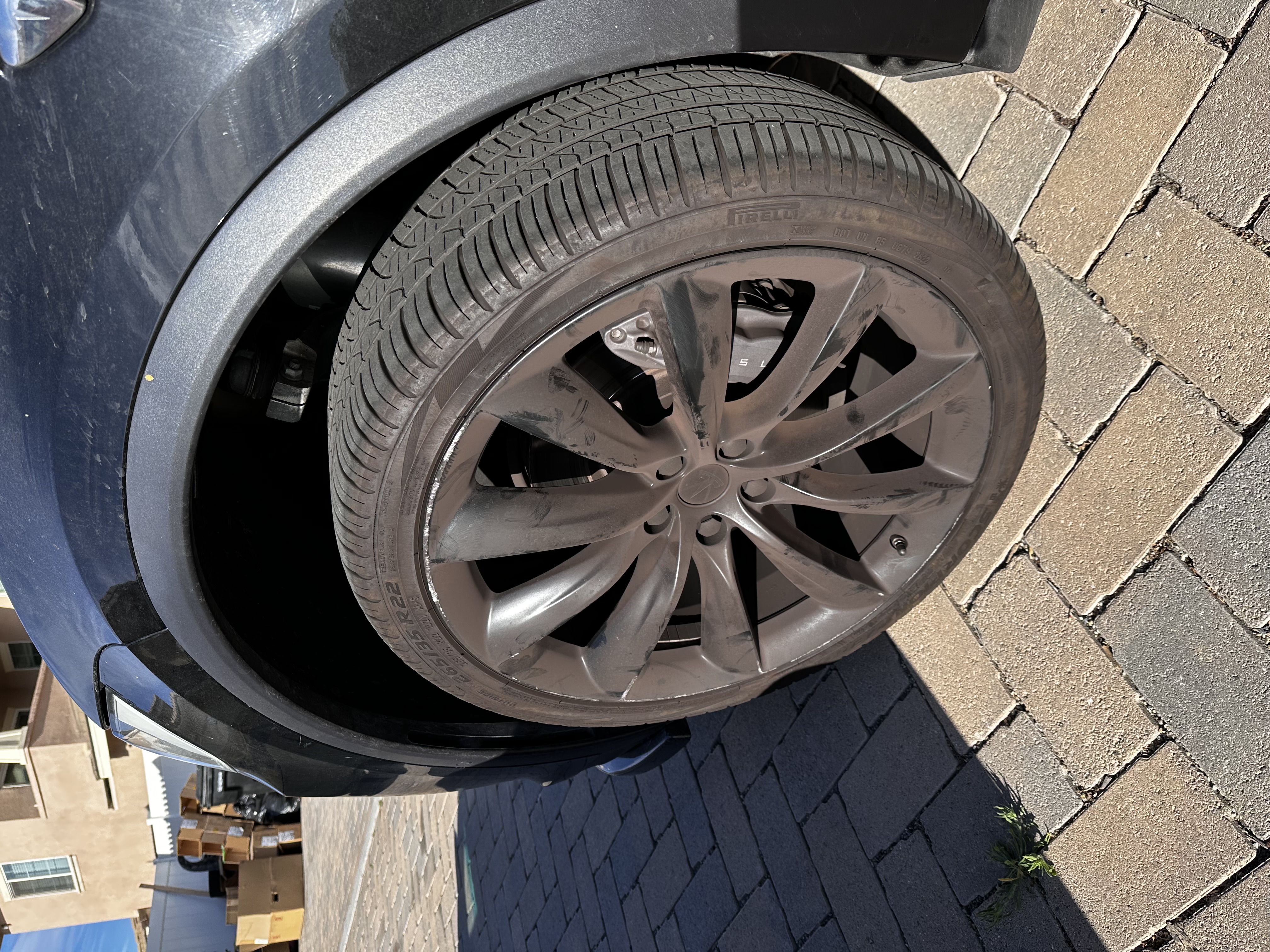 Before mobile detailing rim cleaning on a Tesla Model X by CDA Auto Styling