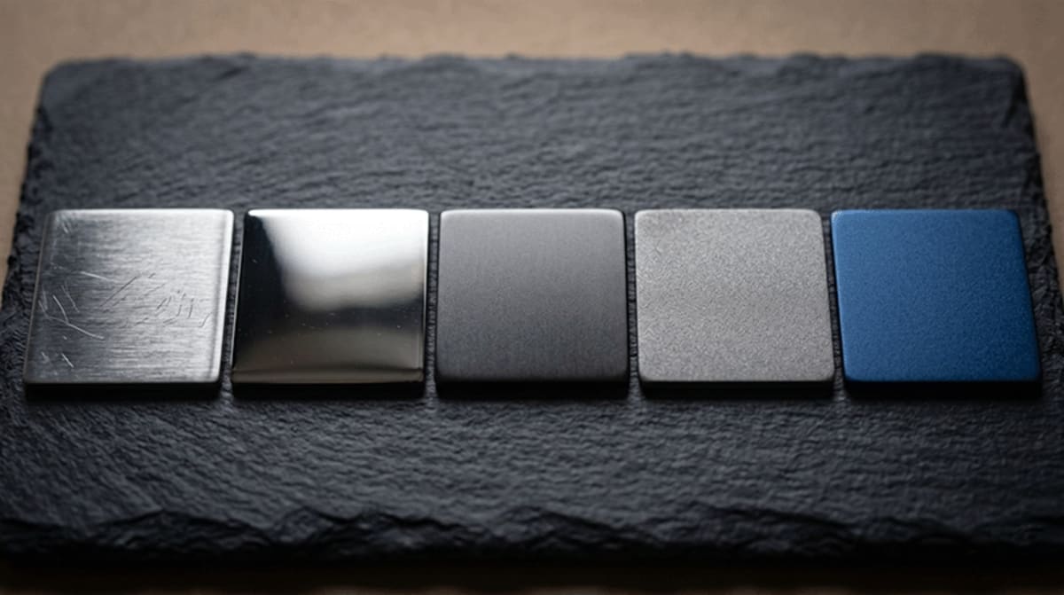 Close-up of brushed stainless steel surface showing fine directional grain texture