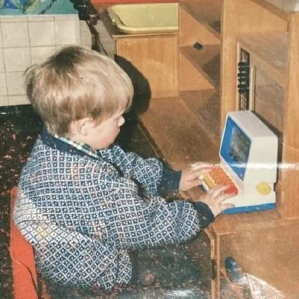 Young David Jones playing on toy computer