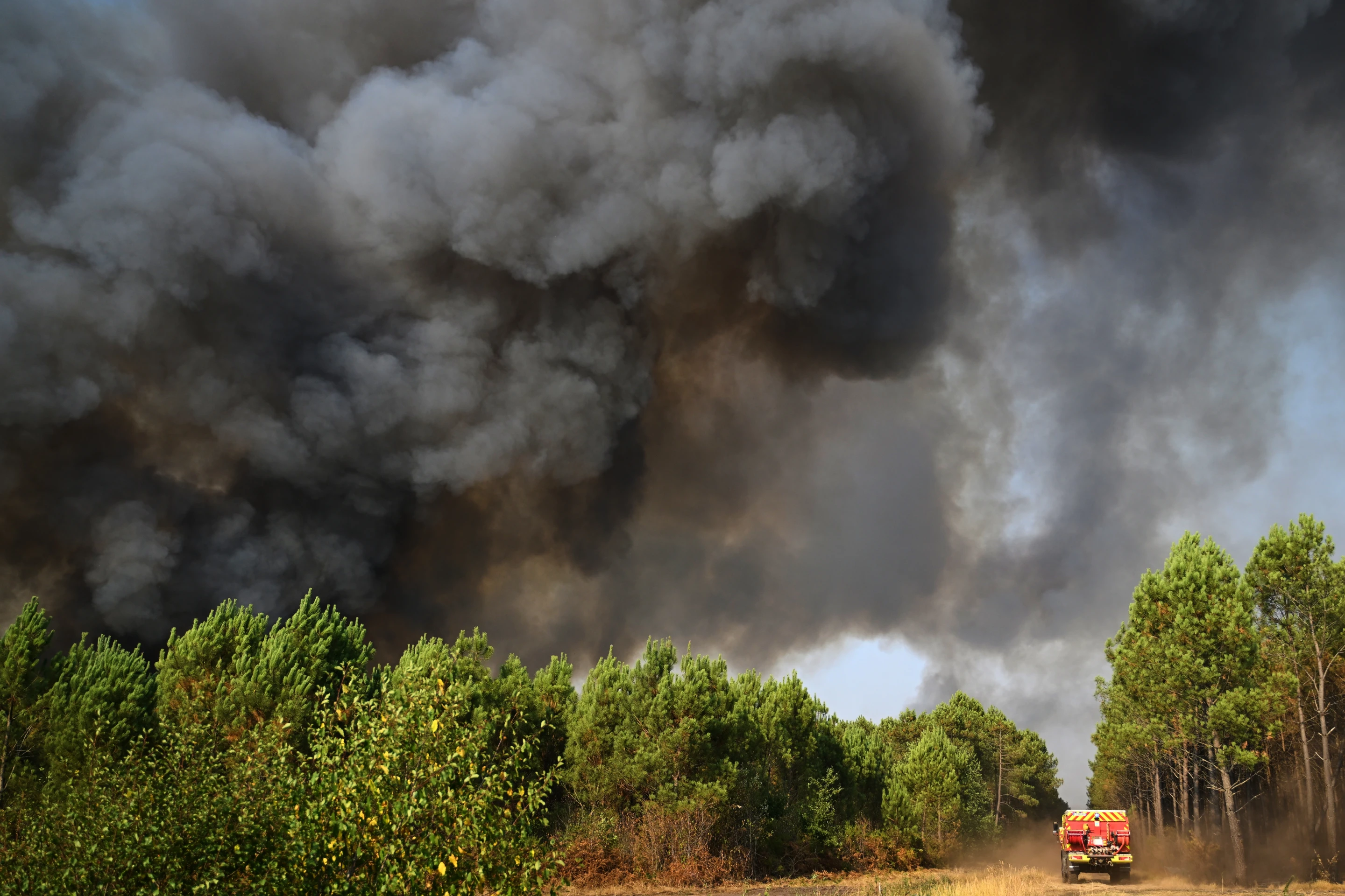 French wildfire evacuees returning home after fires as cooler weather helps control flames