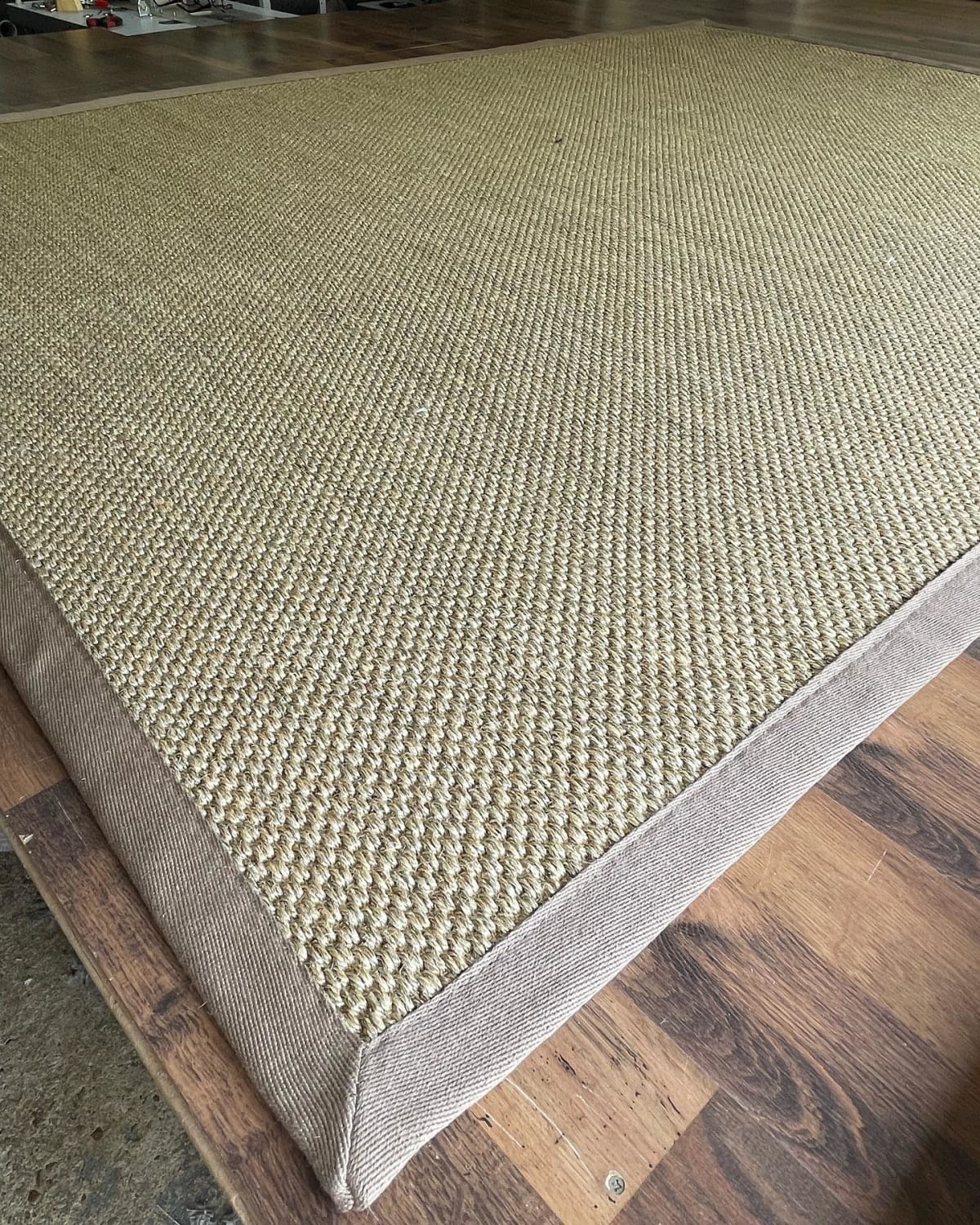 Close-up of mitred sisal rug tape edging