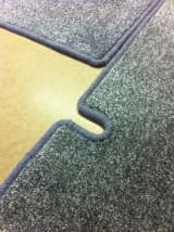 U-shaped edge whipped carpet