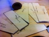 Labeled carpet templates for each stair step, laid out in a workshop with a roll of carpet.