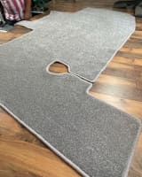 A custom-shaped carpet piece with a cut-out, expertly whipped for a helicopter interior.