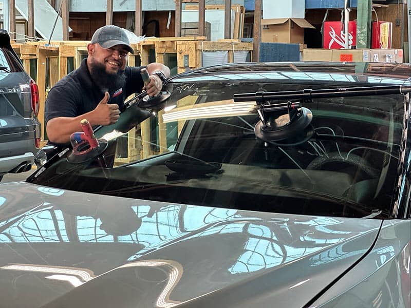 a person replacing windshield