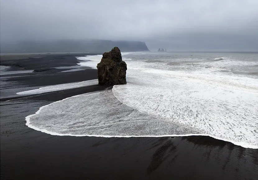 Reynisfjara black sand beach during a foggy day