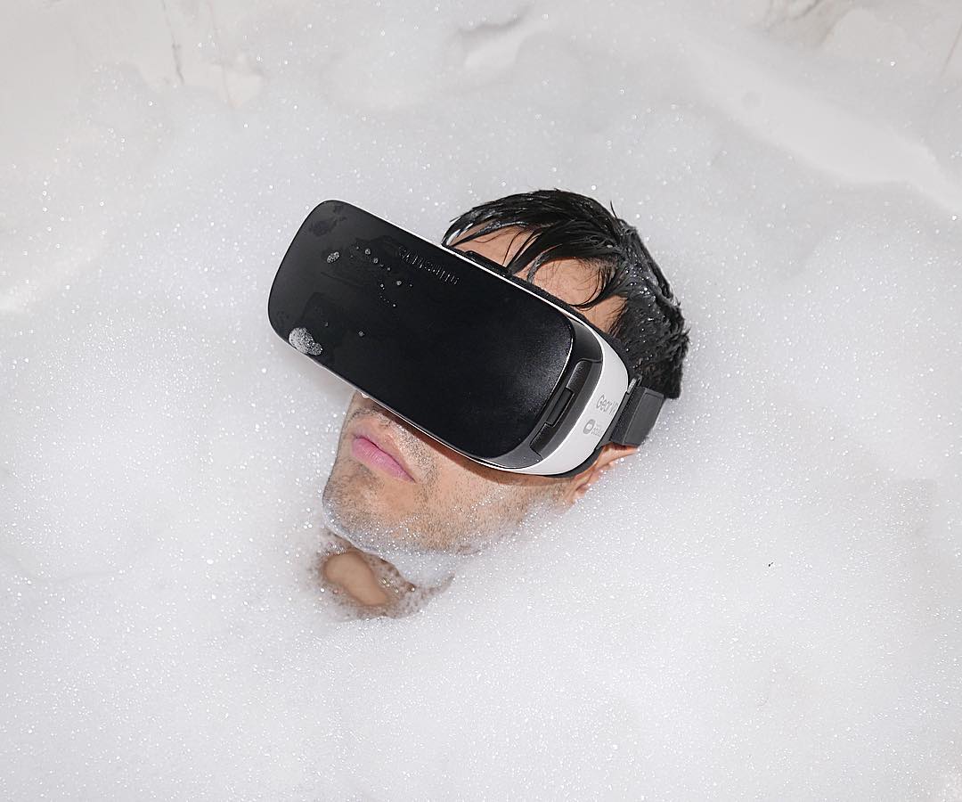 VR Bubble Bath - Man in bathtub wearing VR headset