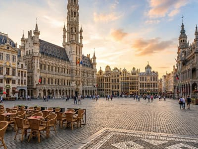 The Grand Place in Brussels with the Gothic Town Hall and gilded guild houses at sunset, Belgium