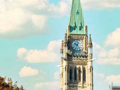 Peace Tower clock close-up against blue sky, Parliament Hill, Ottawa, Canada