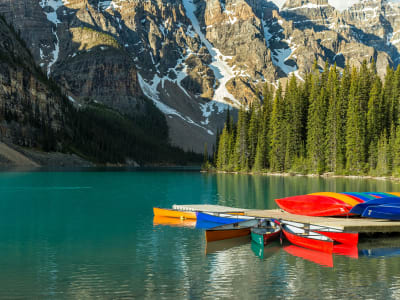 Colourful canoes docked at Moraine Lake boathouse, Banff National Park, Alberta