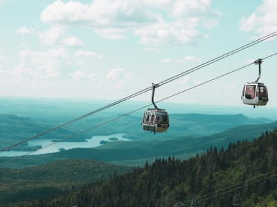 Gondola cabin above green summer mountains and lake, Mont-Tremblant, Quebec, Canada