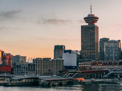 Vancouver Lookout observation tower at dusk with the city skyline glowing at golden hour, British Columbia