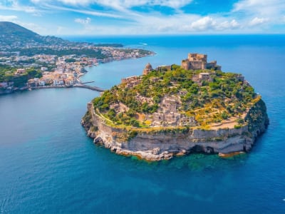 Aragonese Castle Ischia on volcanic rock island surrounded by turquoise sea Campania Italy