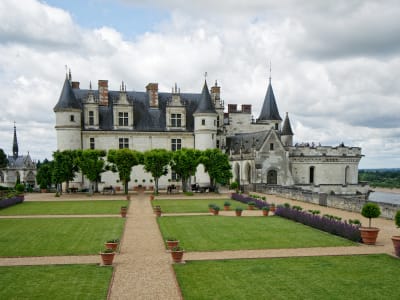 Front facade of Château d'Amboise with manicured lawns and formal gardens, Loire Valley France