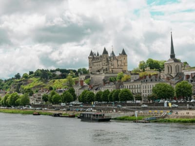 The town of Saumur with its château perched above the Loire River, gateway to the Loire Valley wine region, France