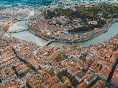 Aerial view of Grenoble surrounded by the French Alps with the Isère River running through the city, France