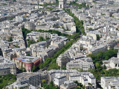Aerial view of the star-shaped Place de l'Étoile with the Arc de Triomphe at its center, Paris France