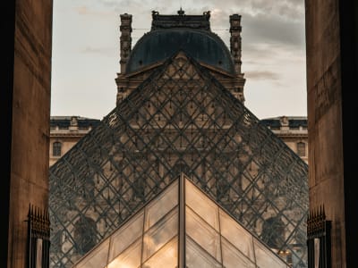 Close-up of the geometric steel and glass structure of I.M. Pei's Louvre pyramid, Paris France