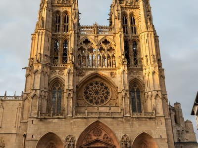 The soaring Gothic tower of Rouen Cathedral bathed in warm golden light, Normandy France