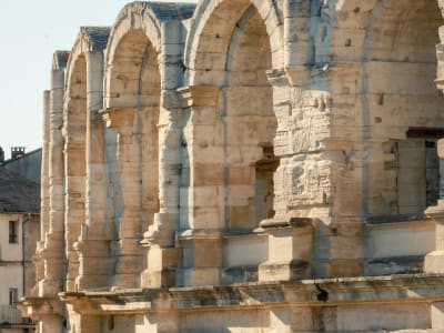Massive Roman stone arches of the Arles amphitheatre up close, a UNESCO World Heritage Site in Provence, France