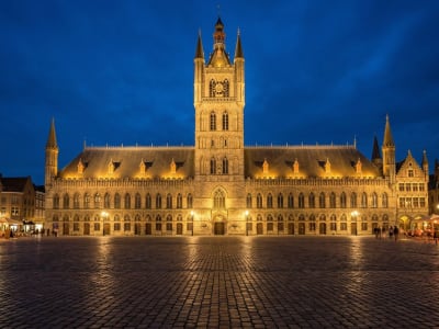 Illuminated Cloth Hall and St Martin's Cathedral on the Grote Markt square in Ypres, Belgium at night