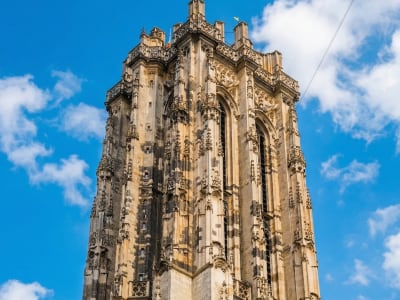 Ornate Gothic facade and tower of Sint-Romboutskathedraal cathedral in Mechelen, Belgium