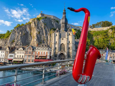 Giant red saxophone sculpture on the Dinant waterfront honouring Adolphe Sax, inventor of the saxophone, Belgium