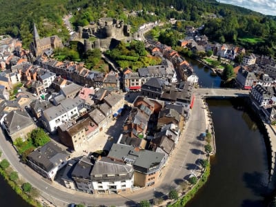 Bird's eye view of La Roche-en-Ardenne with the Ourthe river curving around the town and medieval castle ruins, Belgium
