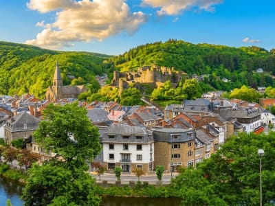 Panoramic view of La Roche-en-Ardenne nestled in a lush green Ardennes valley with the castle on the hillside, Belgium