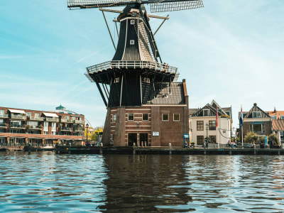 The historic De Adriaan windmill on the banks of the Spaarne river in Haarlem, Netherlands