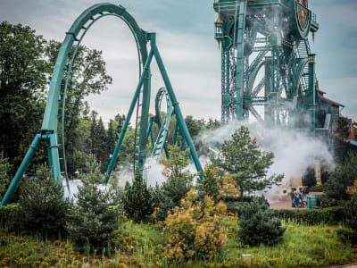 Baron 1898 roller coaster with steam and water splash effects at Efteling theme park, Netherlands