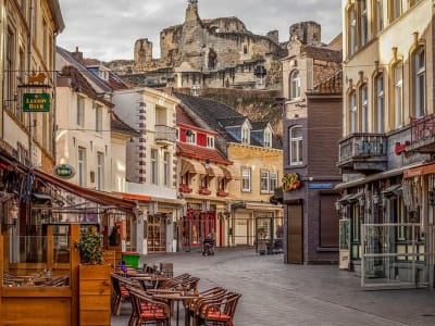 Cosy pedestrian shopping street with cafés and historic facades in Valkenburg aan de Geul, Netherlands