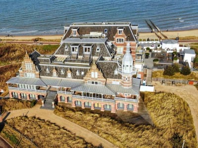 Aerial view of the grand Victorian Grand Hotel Domburg nestled in the coastal dunes, Zeeland, Netherlands