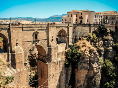 Close-up of the Puente Nuevo bridge arches spanning the deep El Tajo gorge in Ronda, Andalusia, Spain
