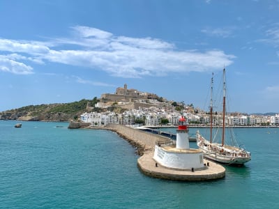 Ibiza Town harbor with sailboats Dalt Vila fortress and whitewashed old town on the hill