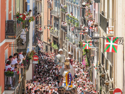 San Fermín festival Pamplona crowded balconies with Basque flags and festive decorations Navarra Spain