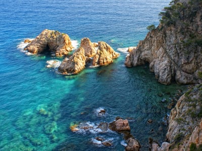 Aerial view of rocky islets and crystal clear turquoise water on Costa Brava Girona Spain