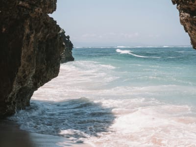 Rocky coastal cliffs with crashing waves on wild Costa Dorada coastline Tarragona Catalonia Spain