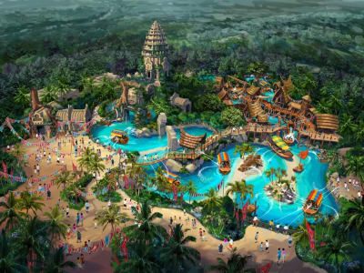 Caribe Aquatic Park PortAventura aerial view with tropical pools water slides and lush greenery Spain
