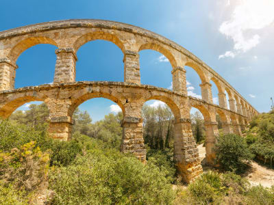 Roman aqueduct Les Ferreres Tarragona ancient stone arches surrounded by green landscape Catalonia Spain