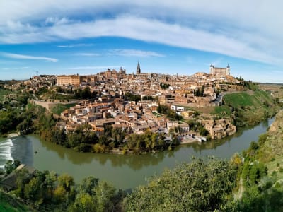 Panoramic view of Toledo UNESCO city with cathedral and Alcázar above the Tagus river Spain