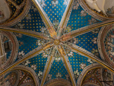 Mudéjar star vault ceiling detail with intricate blue geometric patterns in Toledo Spain
