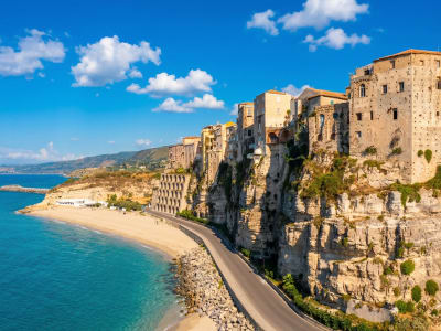 Tropea old town on dramatic white limestone cliff above sandy beach Calabria southern Italy