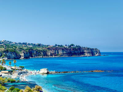 Aerial view of Tropea coastline with cliffs white beach and crystal clear turquoise sea Calabria Italy